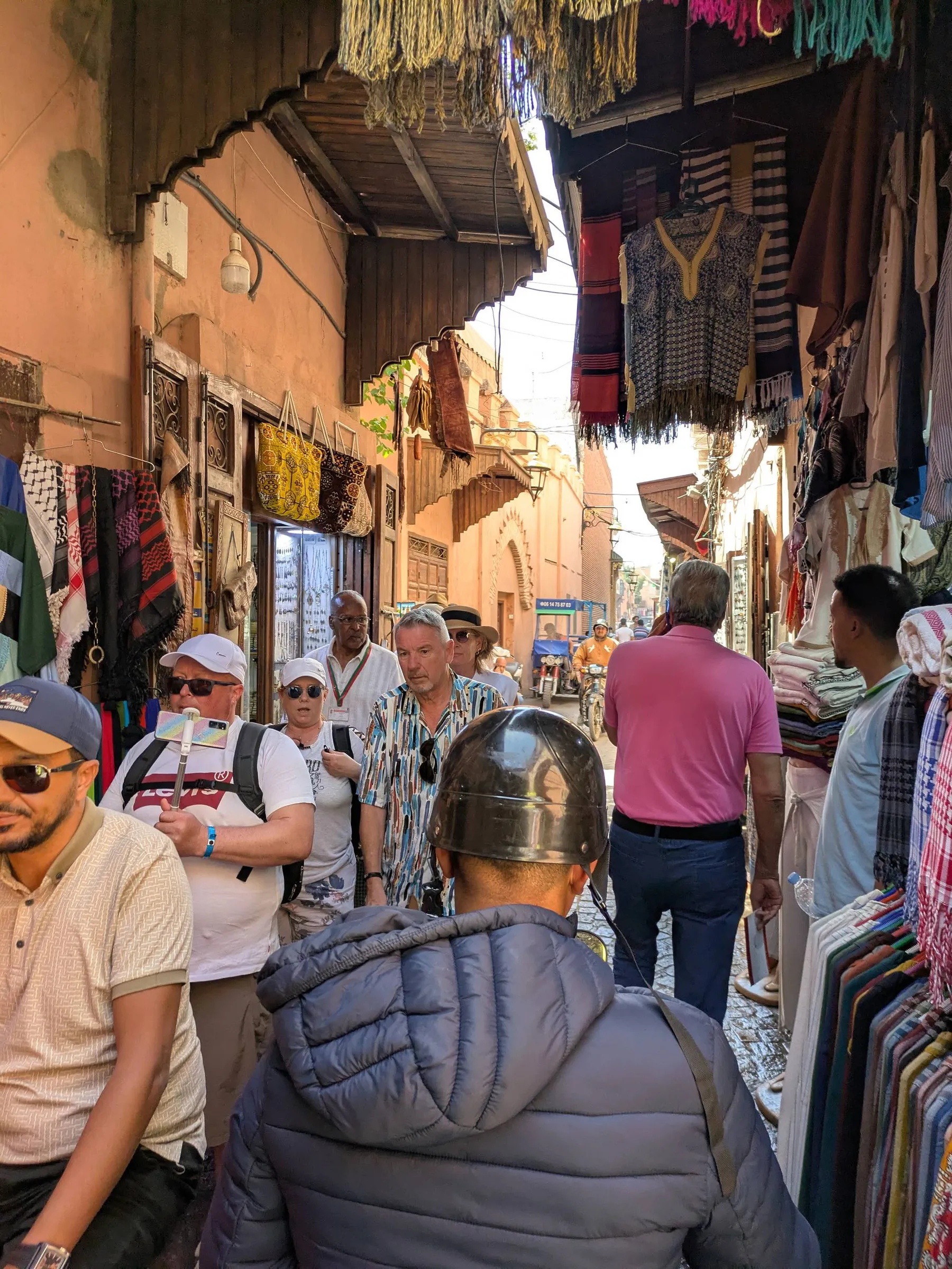 View of one of the narrow streets of the Medina of Marrakesh, completely crowded